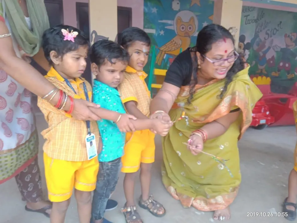 A teacher sharing a happy moment with children