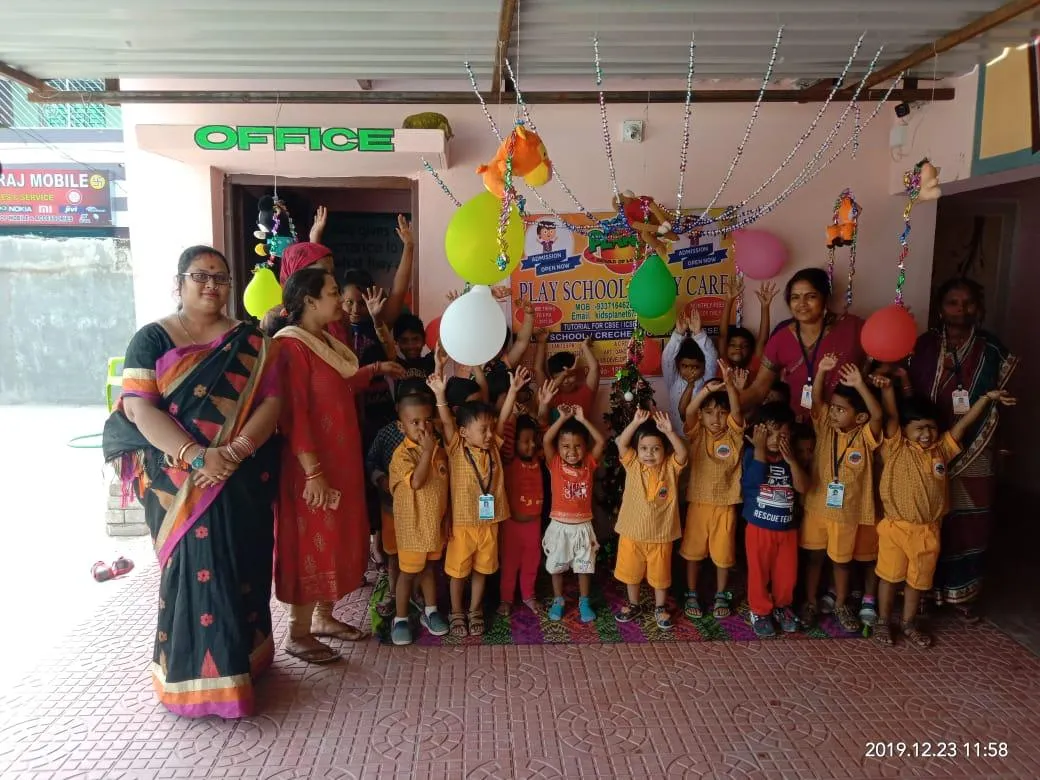 Children and teachers celebrating together