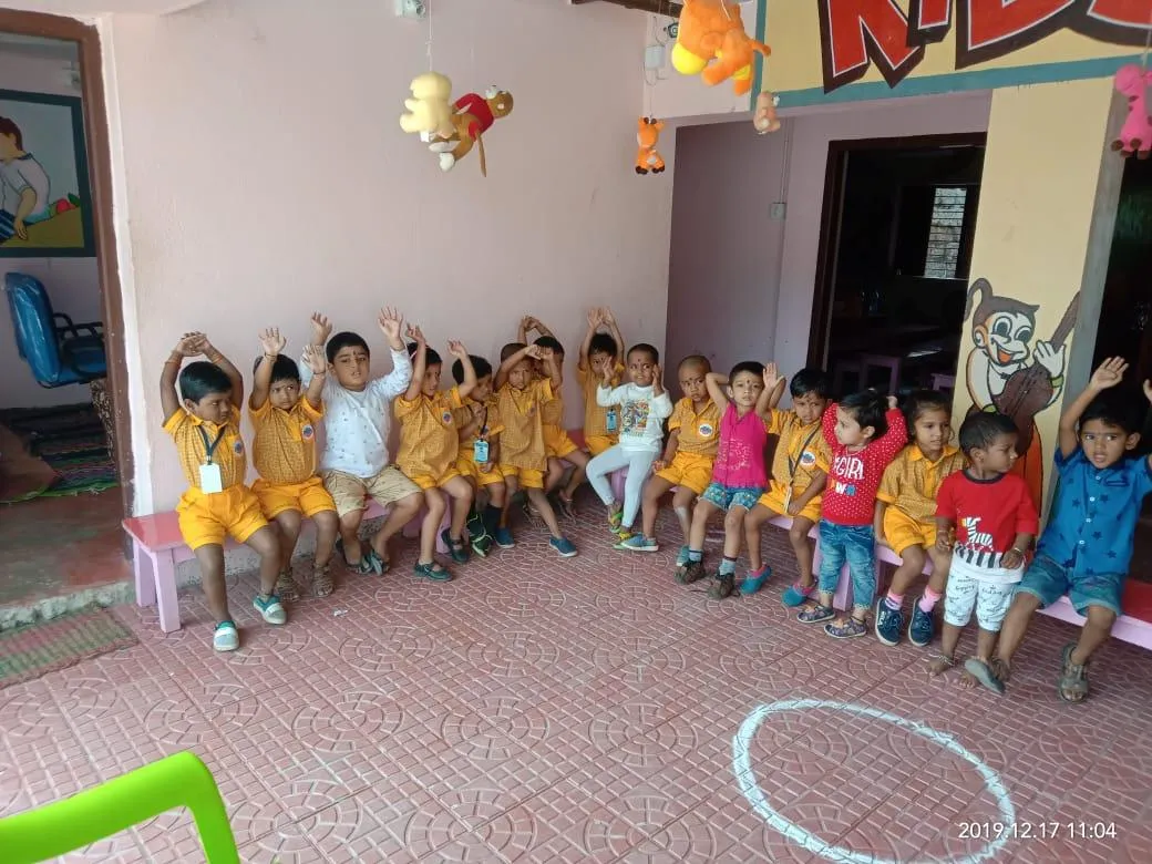 Children joining a movement activity together