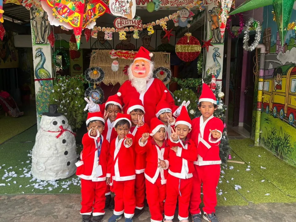Children in Santa costumes celebrating Christmas at Kids Planet, Bhubaneswar
