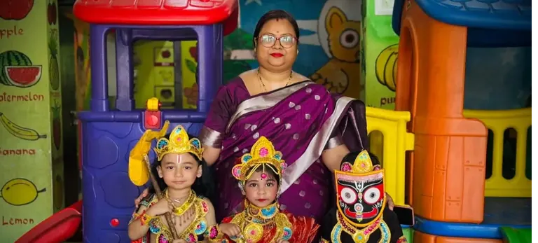 Teacher and children celebrating together at Kids Planet